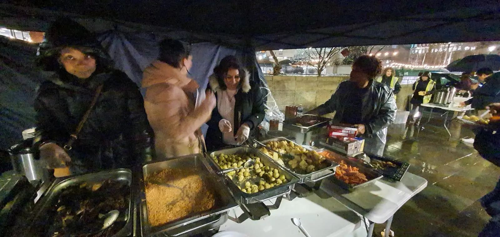 Not Forgotten volunteers sharing hot food at the outreach